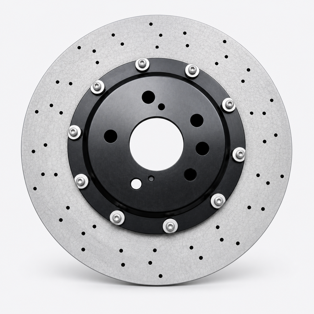 Drilled carbon ceramic rotor with a black center hat, styled from factory photograph IMG-032