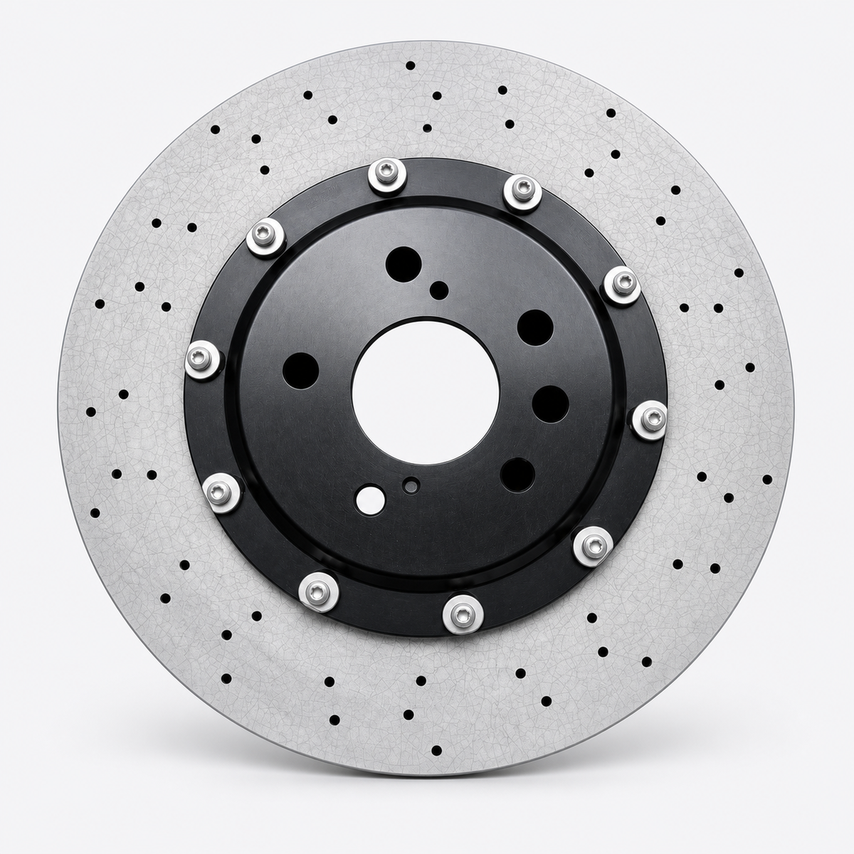 Drilled carbon ceramic rotor with a black center hat, styled from factory photograph IMG-032