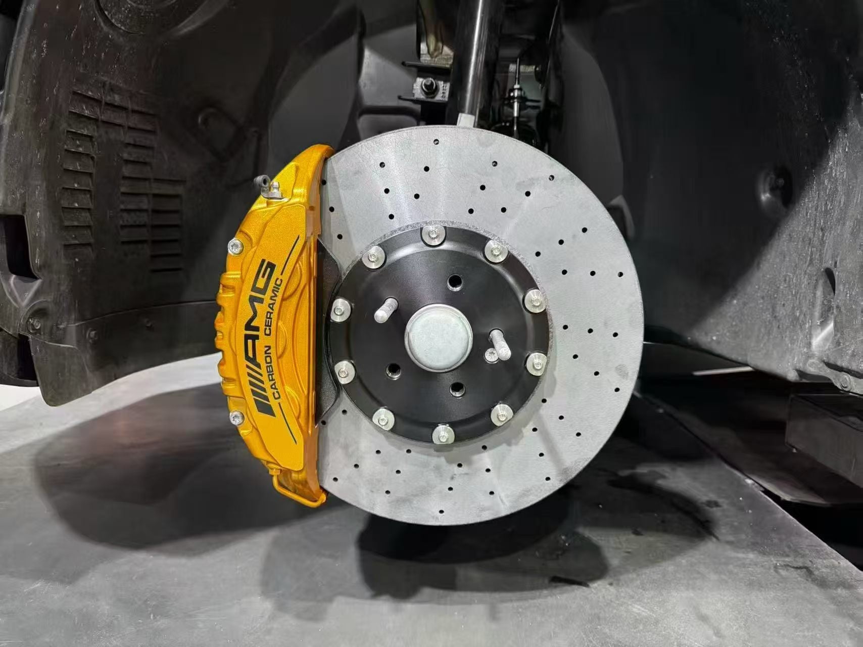 Rotor, mounting hat and refinished gold caliper with wheel removed