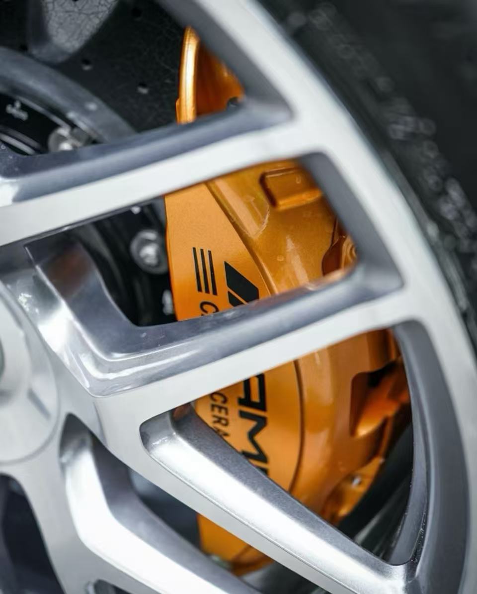 Refinished gold caliper visible through the wheel spokes